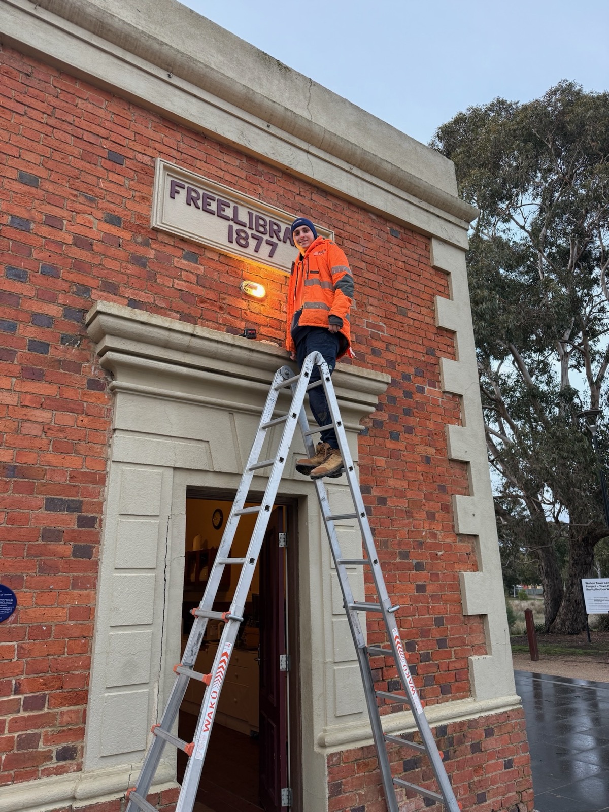 Fowler Electrical technician working on the heritage Free Library building in Wallan